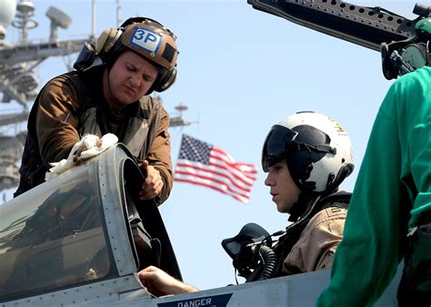 Crew members at work on USS Theodore Roosevelt