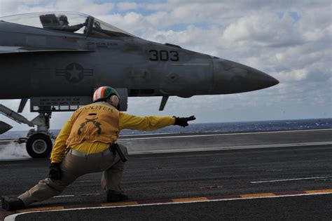 Flight deck operations on USS Theodore Roosevelt at night