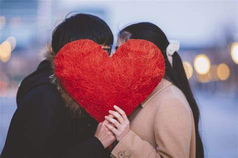 A Japanese woman giving chocolates to a man on Valentine's Day