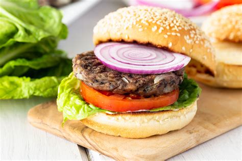 Veggie burger with avocado and sweet potato fries