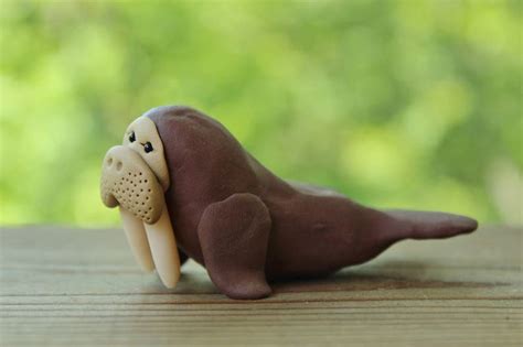 A walrus figurine made from air-dry clay and painted with acrylic paint