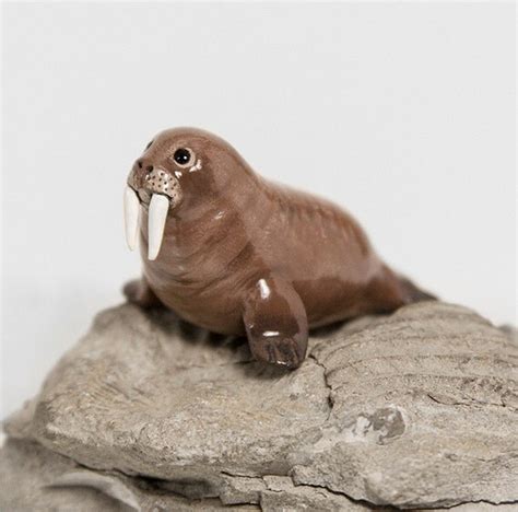 A painted walrus figurine made from air-dry clay