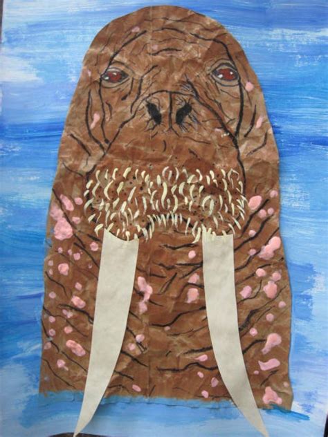 A walrus collage made from recycled materials and glued onto cardboard