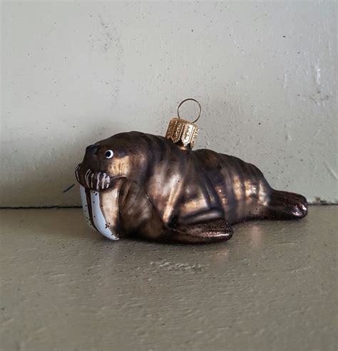 A walrus ornament made from air-dry clay and painted with acrylic paint