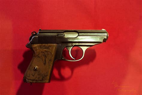 Walther PPK pistol on a wooden table