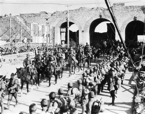 Japanese soldiers marching through the streets of Shanghai in 1937