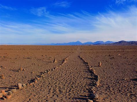 A desert landscape with a winding path, symbolizing the challenges of the wayward path