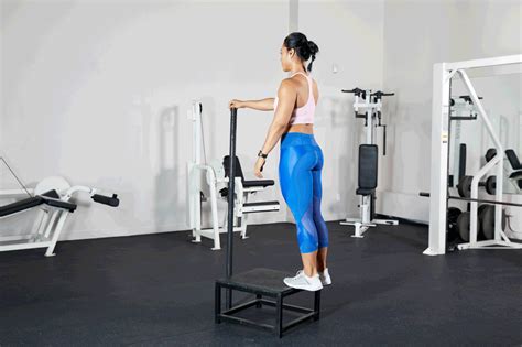 Woman doing calf raises with proper form