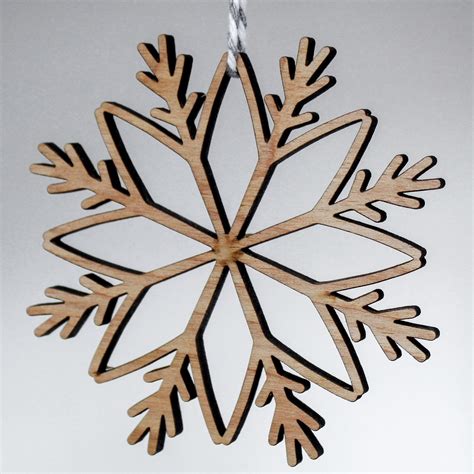 Wooden snowflake ornaments in various sizes and colors