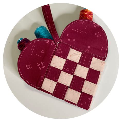 A close-up of a woven heart basket pattern