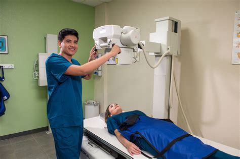 X-ray technician assisting doctor