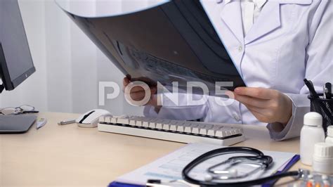 X-ray technician keeping patient records