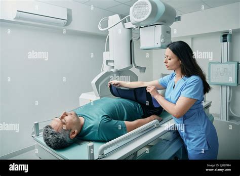 X-ray technician preparing patient