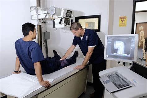 X-ray technician maintaining patient safety