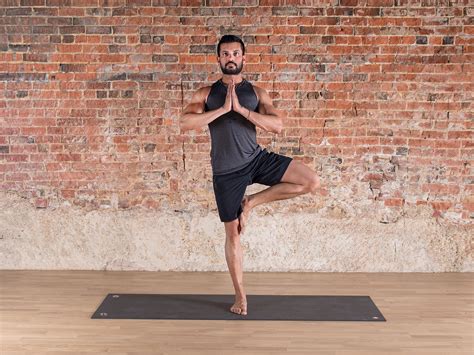 Senior practicing yoga tree pose